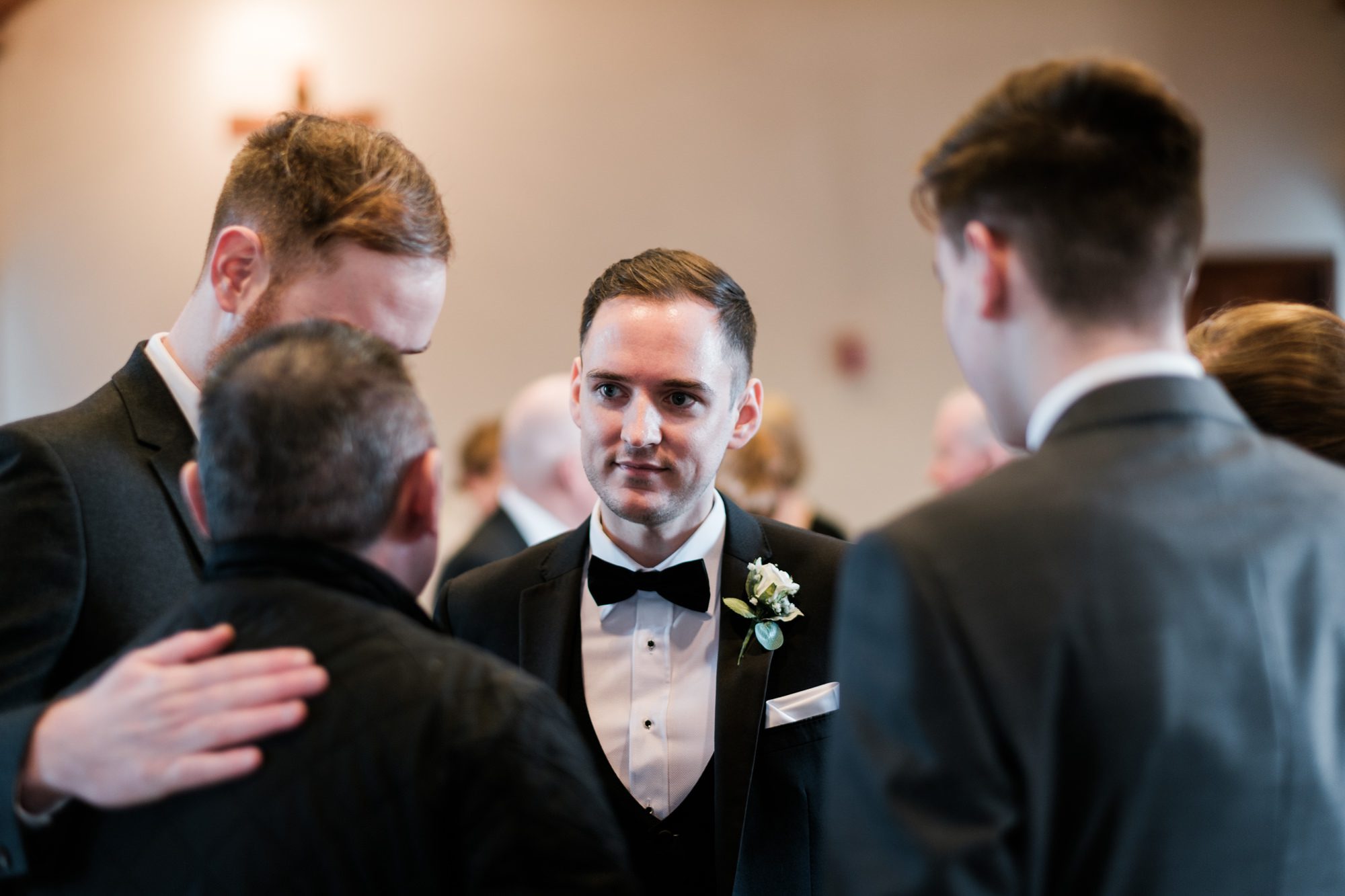groom chatting to guests