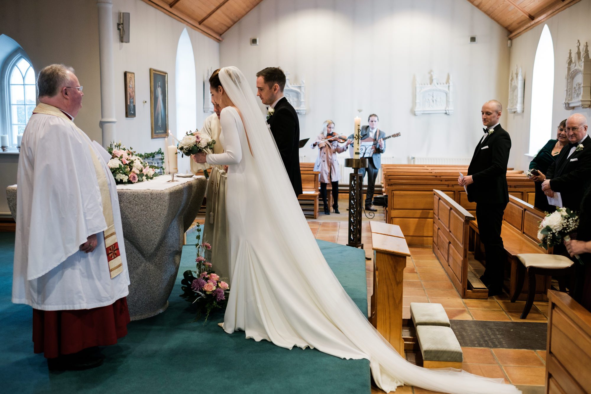 bride and groom at altar