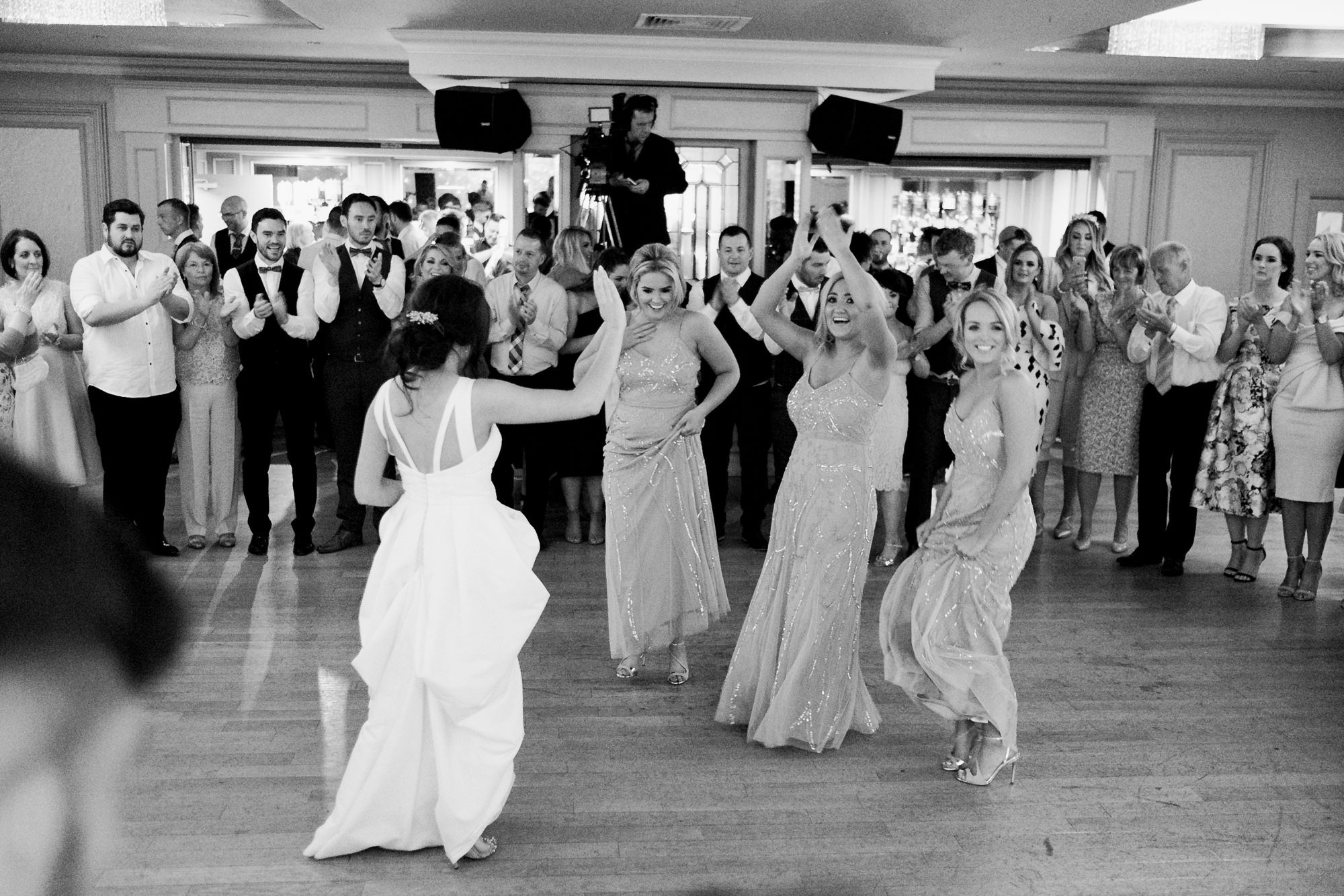 bride dancing with bridesmaids