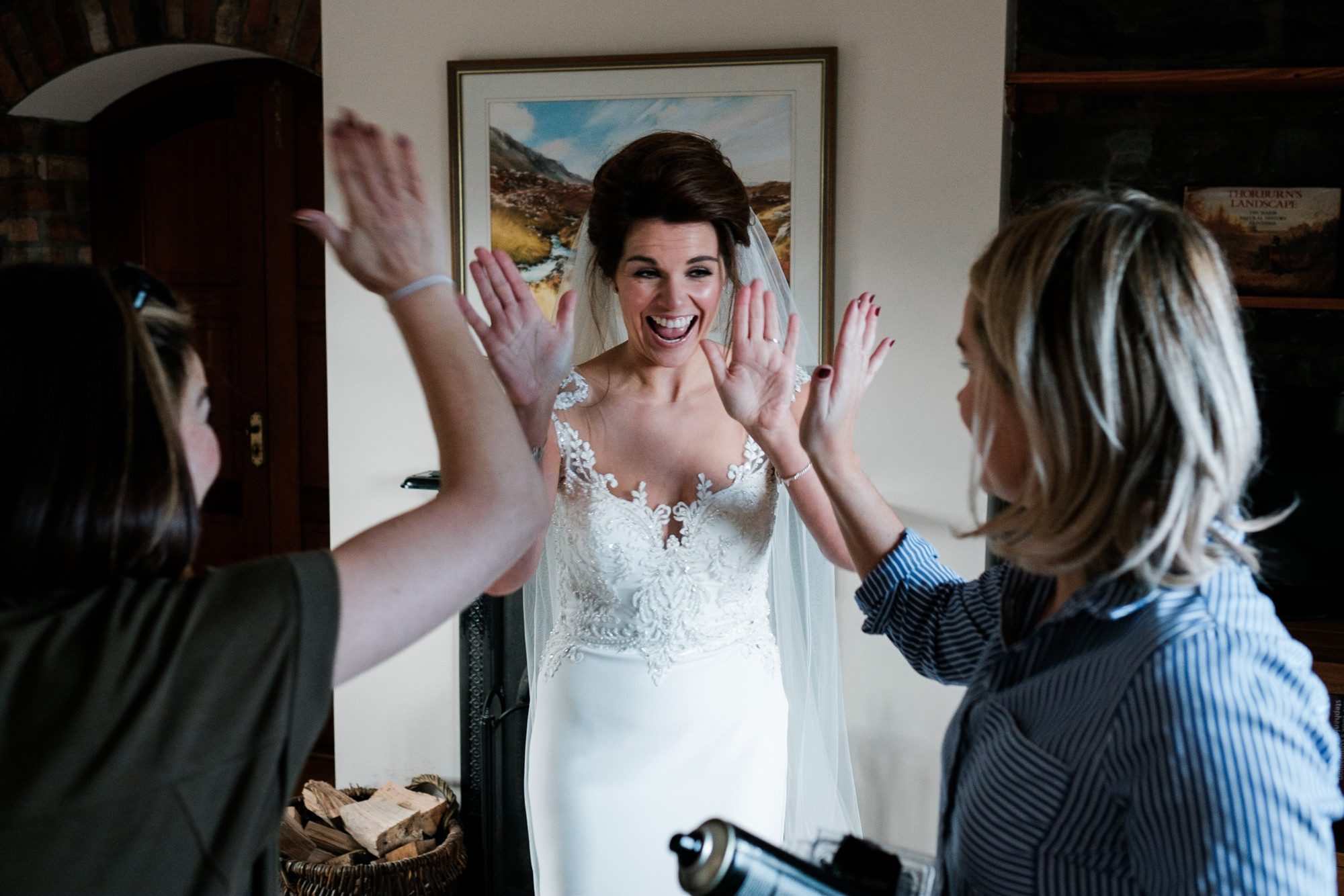 bride and mua doing high fives