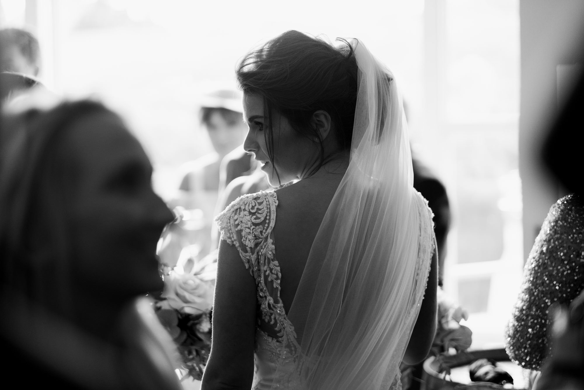 candid portrait of bride during drinks reception
