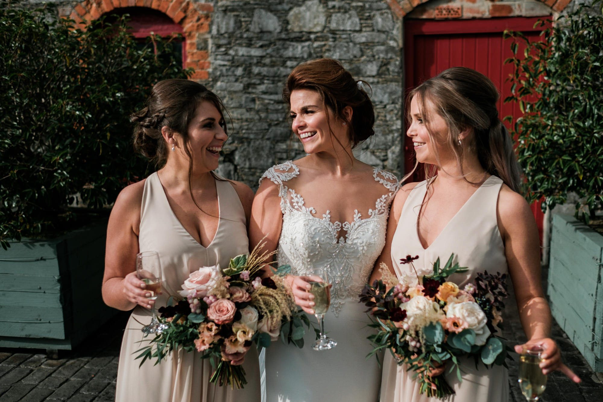 bride and bridesmaids in sunshine