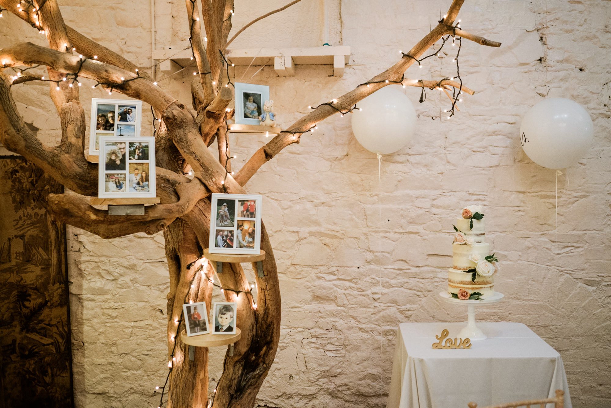 cake tree with photos and cake at Larchfield Estate