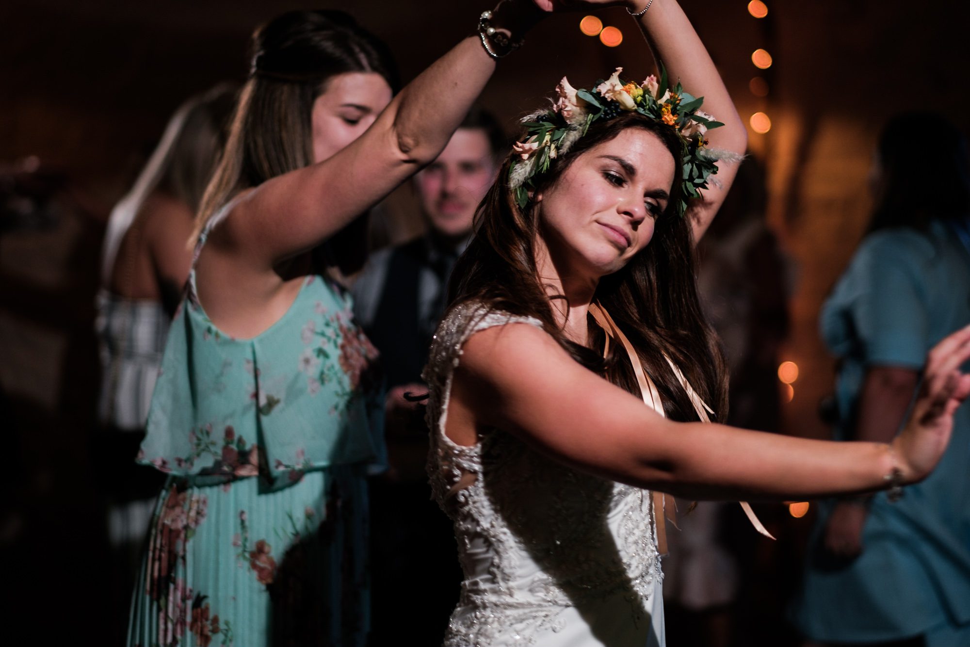 bride dancing with flower crown on