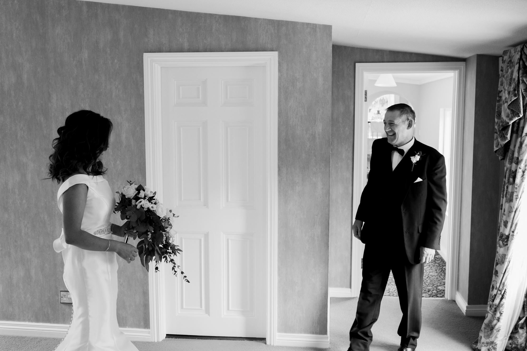 father of bride sees her in dress for first time